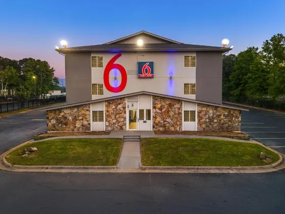 Hotel with the sign on the front of it