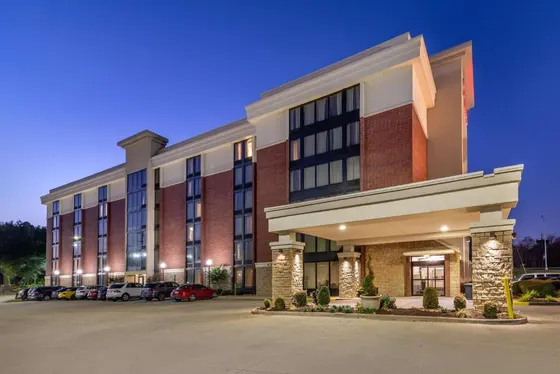 Rendering of a hotel with a parking lot