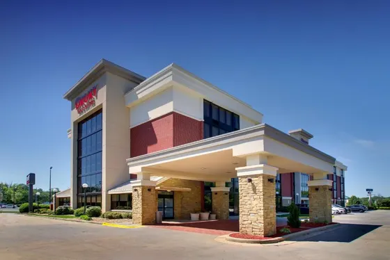 Hotel building with a sign on top of it