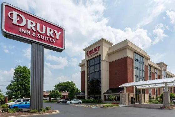 Durry inn and suites sign in front of a building