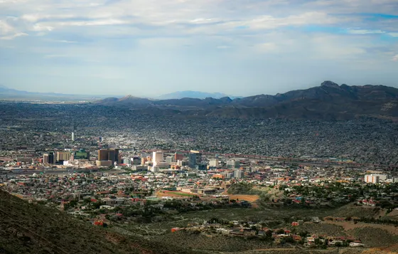 Desert city at the foot of rugged mountains