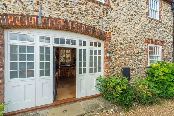 Estcourt House Norfolk flint facade with arched brickwork
