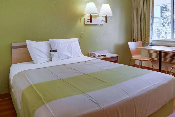 Bedroom with a large bed and a table