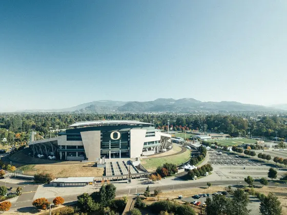 Autzen Stadium and its Oregon O with wooded hills beyond