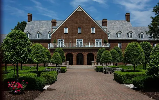 Large brick building with a balcony on top of it