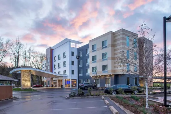 Rendering of a building in a parking lot