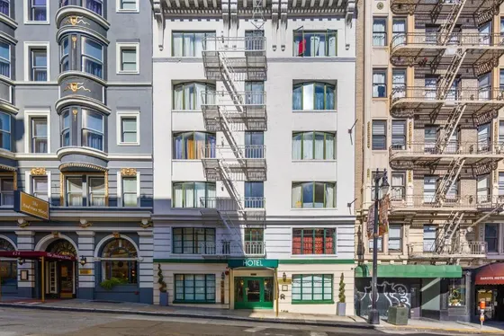 Tall building with fire escapes on the side of it