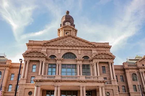 Pink granite courthouse with a clock tower
