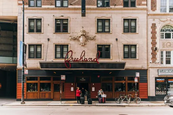 Building with a sign for a restaurant