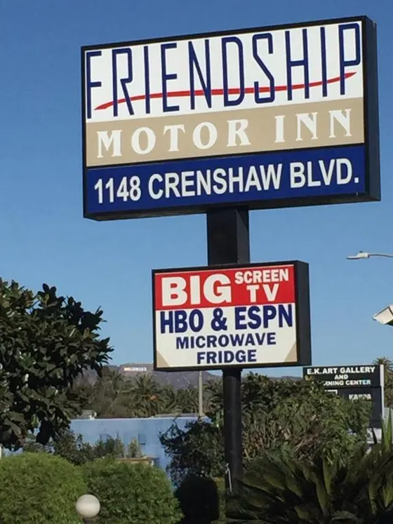 Sign for a motor inn on a street