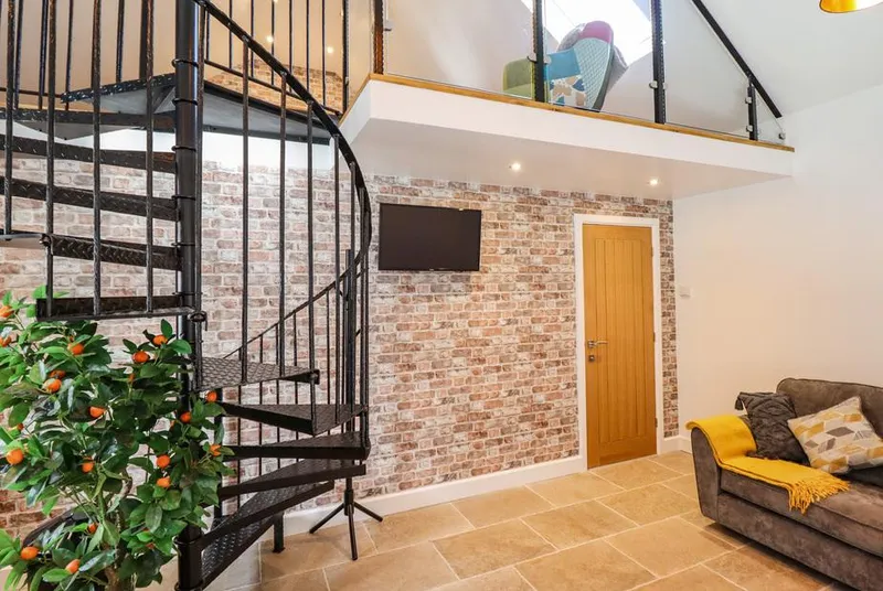 Glyndwr lounge with patio doors and spiral stair