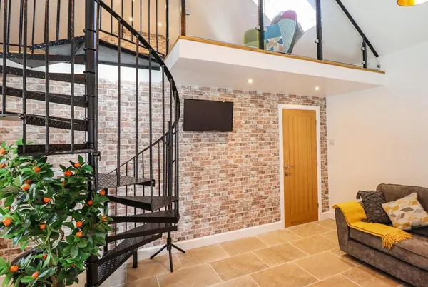 Glyndwr lounge with patio doors and spiral stair