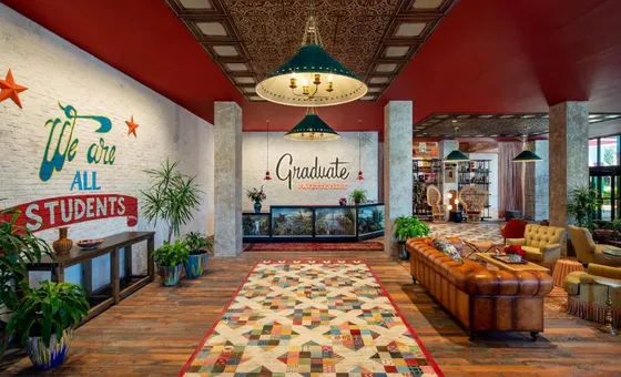 Lobby of a restaurant with a couch and tables