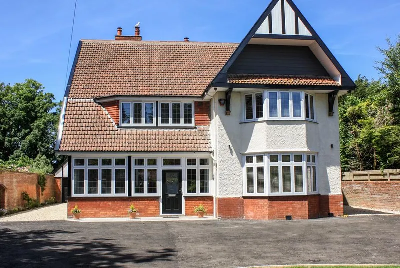 Greenlawns front facade showing Arts and Crafts character and scale