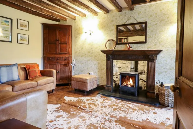 Gwengraig rustic lounge with fireplace and beams