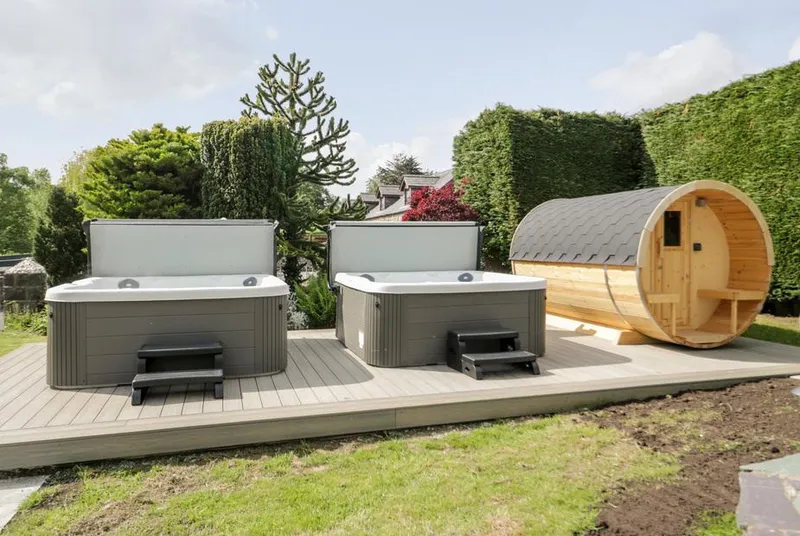 Gwern Borter Manor twin hot tubs with barrel sauna