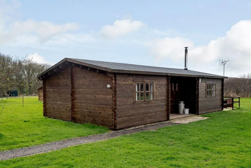 Halfmoon Wood full cabin exterior on the grass