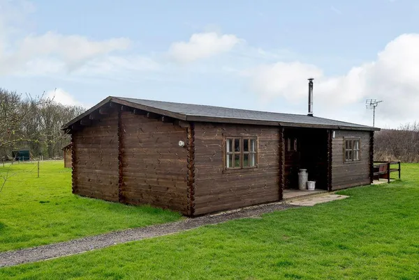 Halfmoon Wood full cabin exterior on the grass