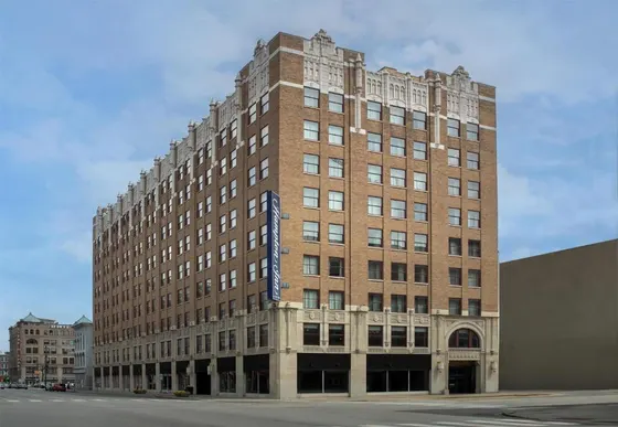 Historic brick Hampton Inn on a downtown corner