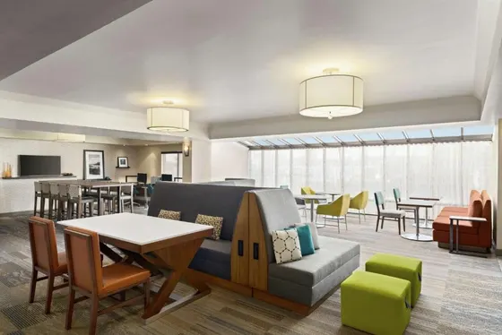 Living room with a couch and a table and chairs