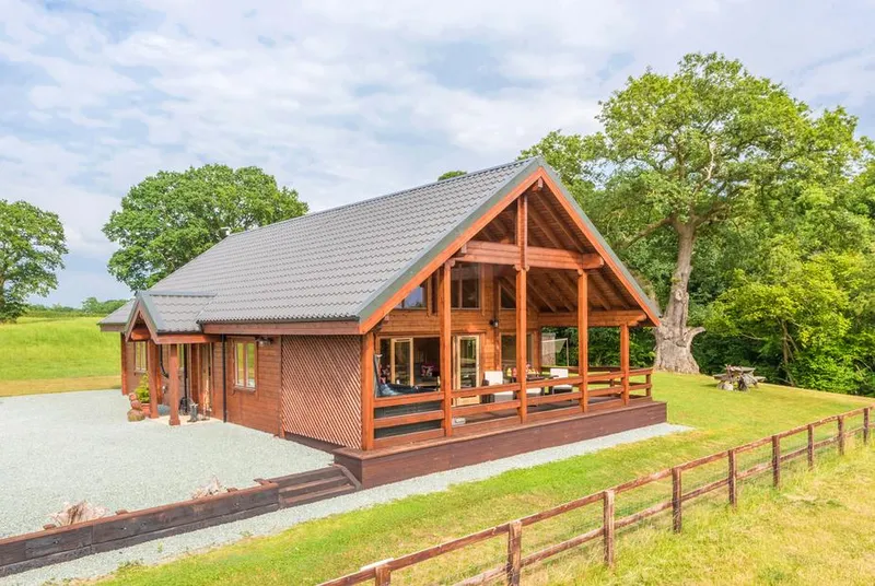 Hampton Lodge full timber lodge in its lawn setting