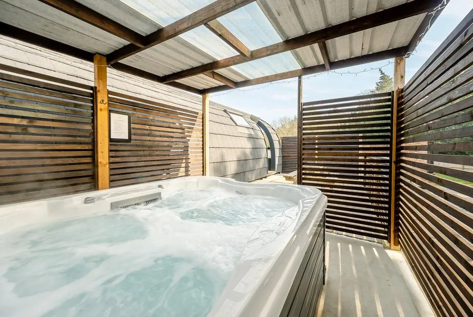 Hare covered private hot tub beside the glamping pod