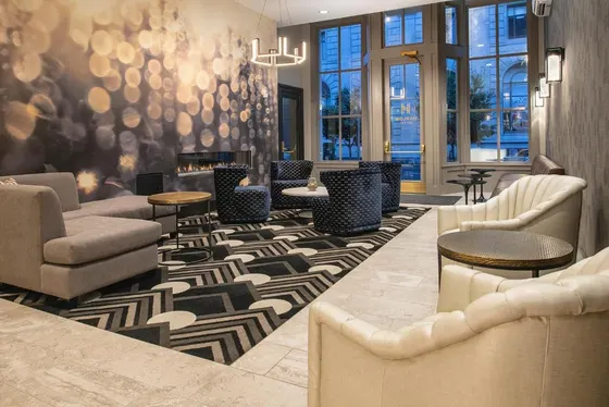 Lobby with couches and chairs and a fireplace