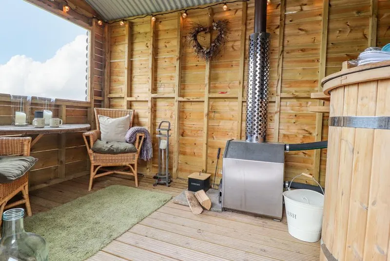 Heather Hut at Copy House Hideaway covered hot tub beside cosy seating