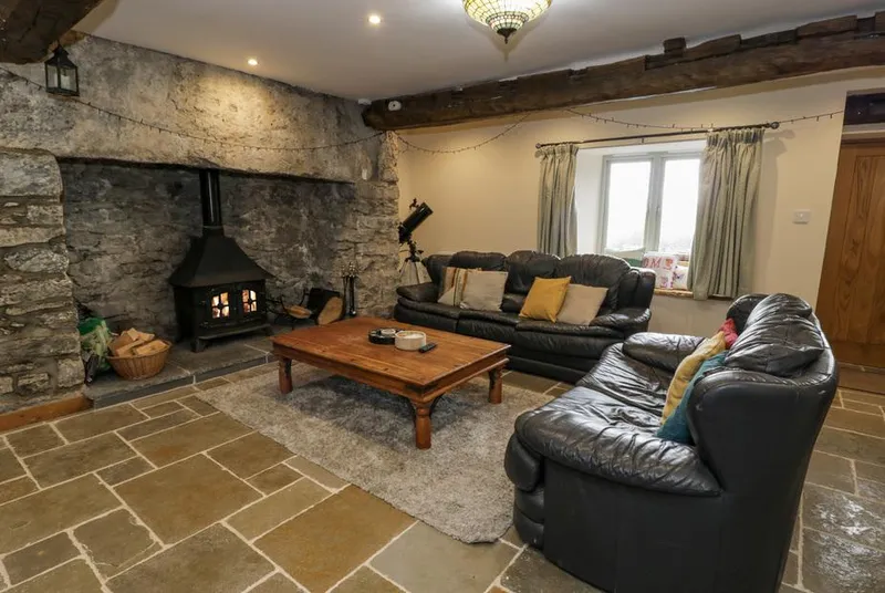 Hen Dy Craig Yr Ronwy lounge with huge stone fireplace