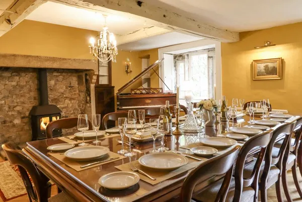 Hilltop House formal dining room set for 12 with grand piano