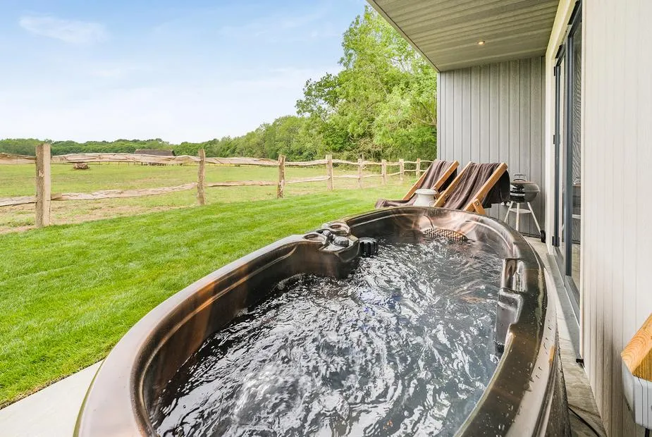 Hillview hot tub on deck overlooking Sussex countryside