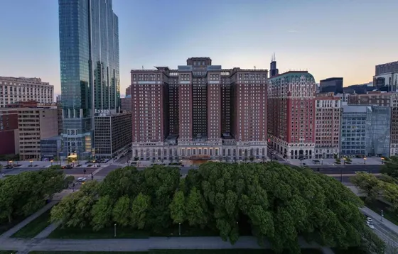 View of a city with tall buildings and trees