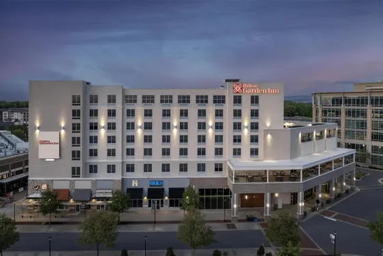 Large white building with a sign on it
