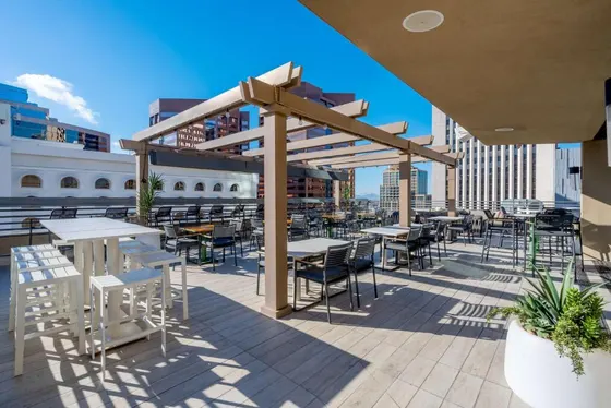 Patio with tables and chairs on a roof
