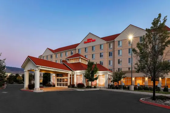 Rendering of a hotel with a parking lot
