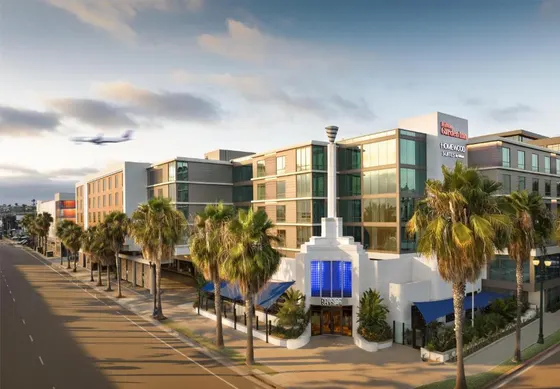 Rendering of a building on a street with palm trees