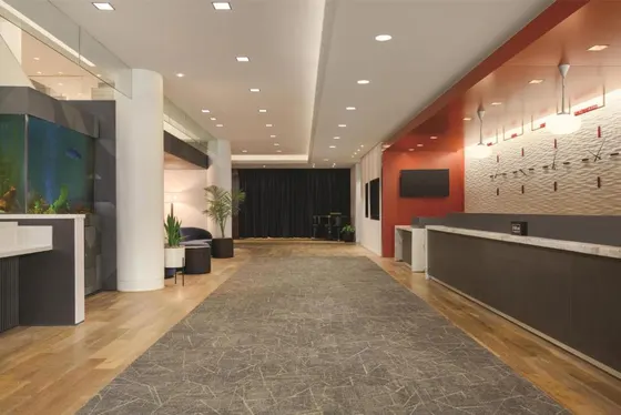 Office lobby with a reception desk and a waiting room