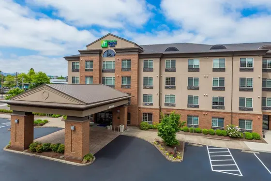 Rendering of a hotel with a parking lot