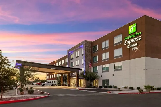Exterior view of a hotel with a parking lot
