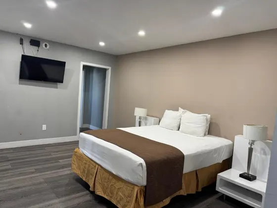 Bedroom with a bed and a flat screen tv