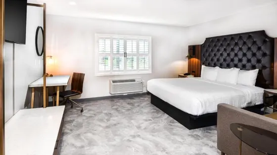 Hotel room with a bed and a desk