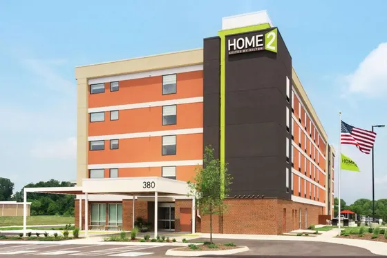 Office building with a home sign on it