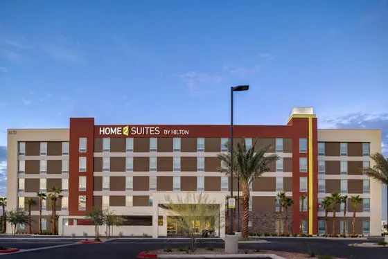 Large building with a sign for a hotel