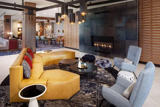 Living room with a couch and chairs and a fireplace