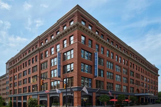 Large red brick building on a city street