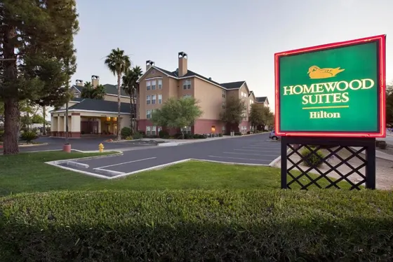 Sign for homeschool suites in front of a street