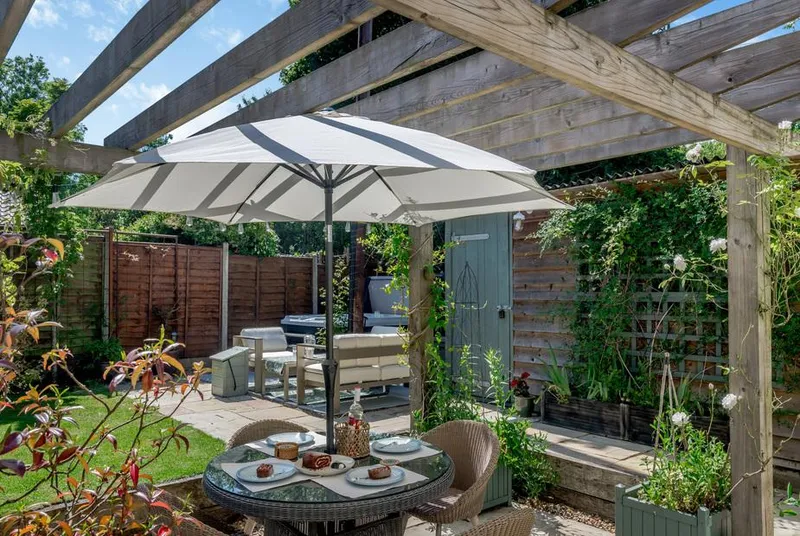 Hope Cottage private garden seating and hot tub area
