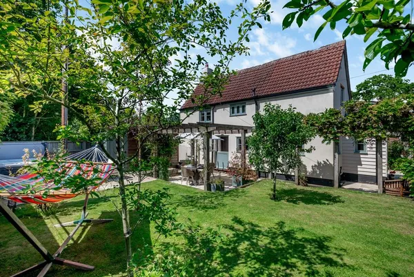 Hope Cottage exterior and enclosed garden with hammock