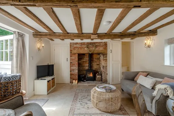 Hope Cottage living room with beams and log burner