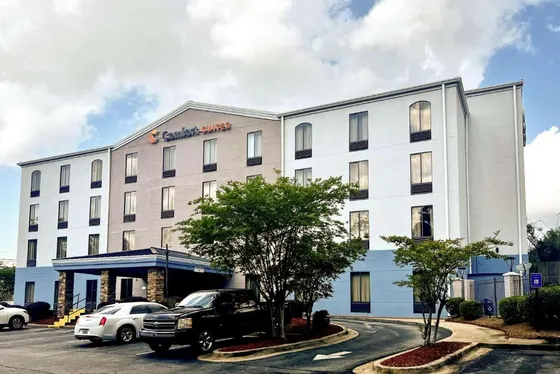 Hotel with a truck parked in a parking lot
